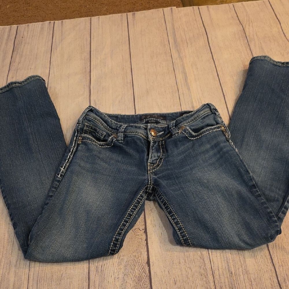 Blue Boot Cut Jeans with Subtle Fading